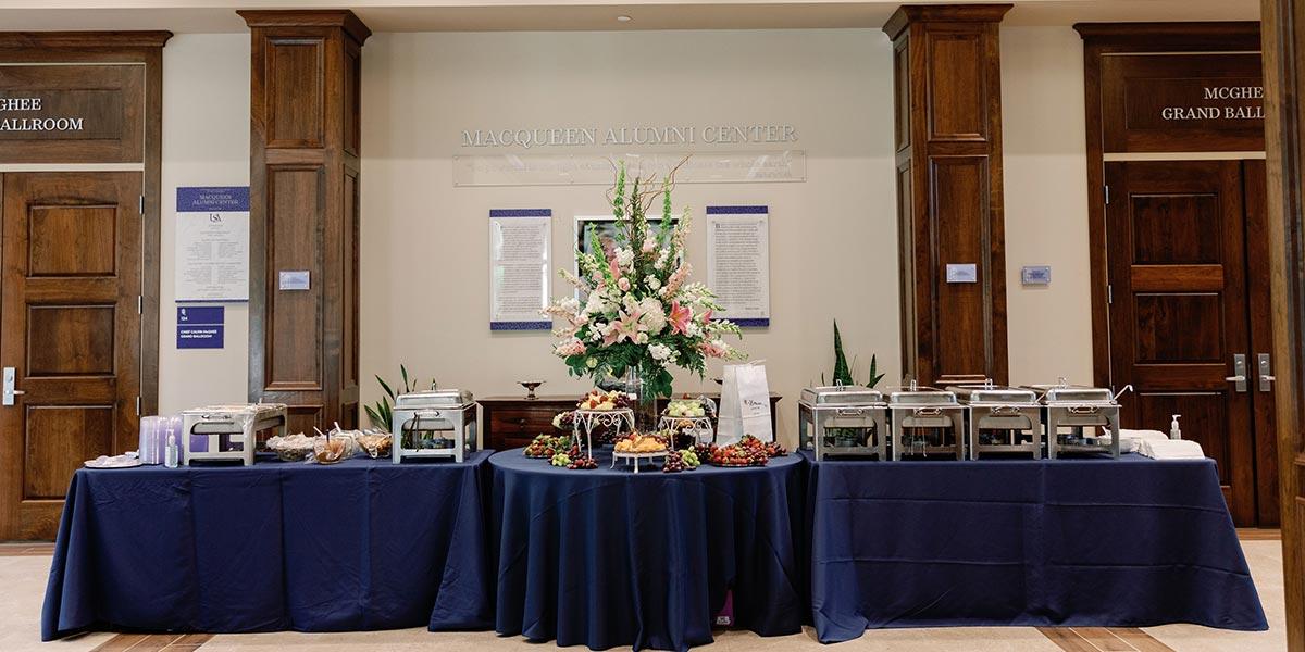 Buffet table with a large centerpiece 