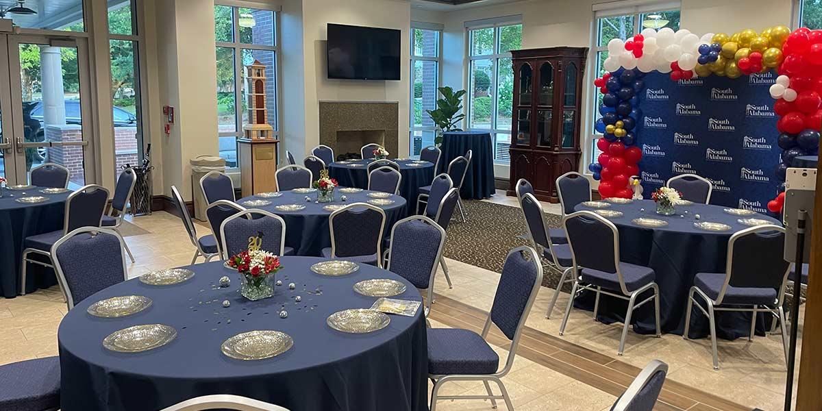 Room set with tables and photo area 
