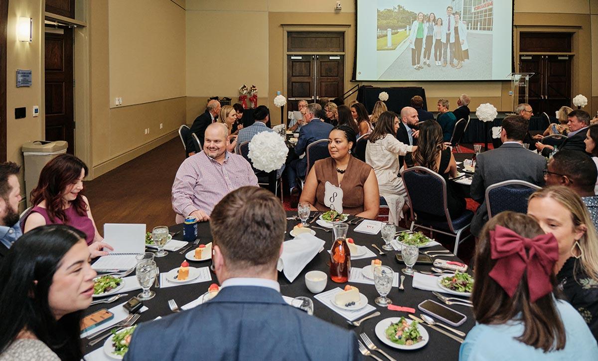 Group at table during event.