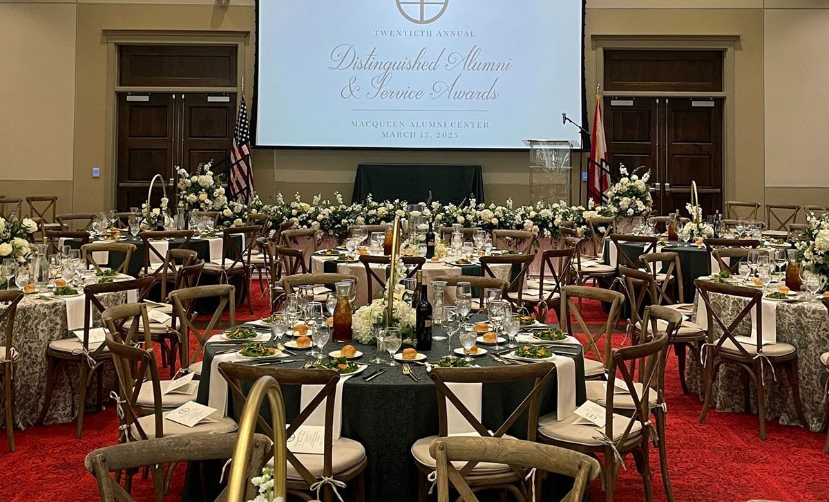 Screen in background with tables and chairs.