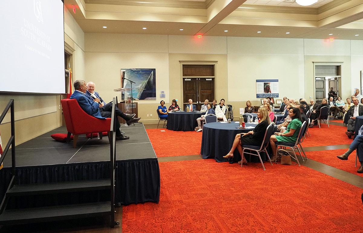 President Bonner on stage at President Council's meeting.