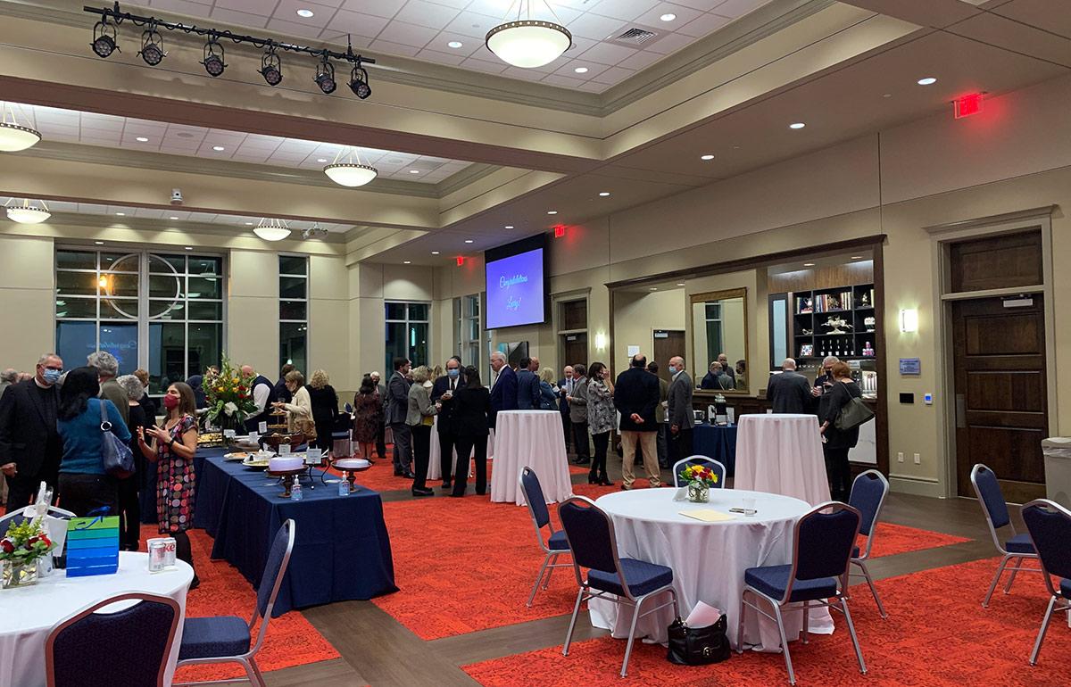 Wide view of ballroom with event going on,