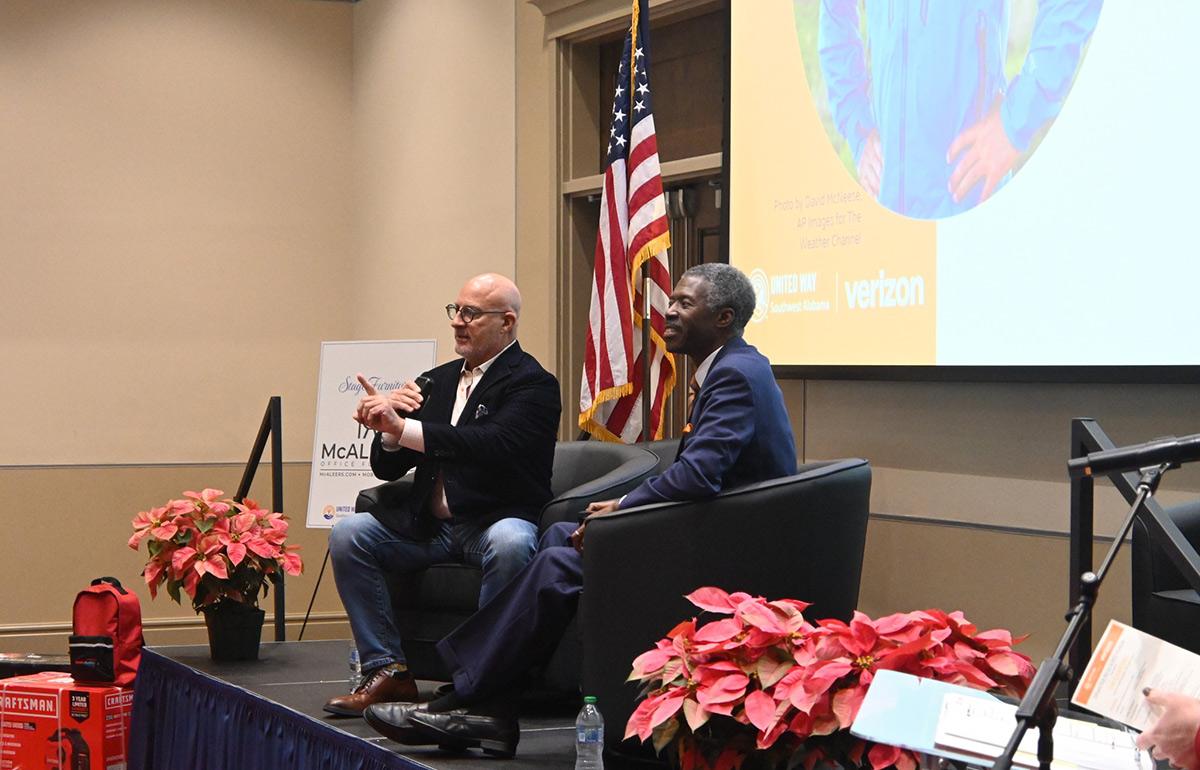 United Way campaign with Alan Seals sitting on stage.