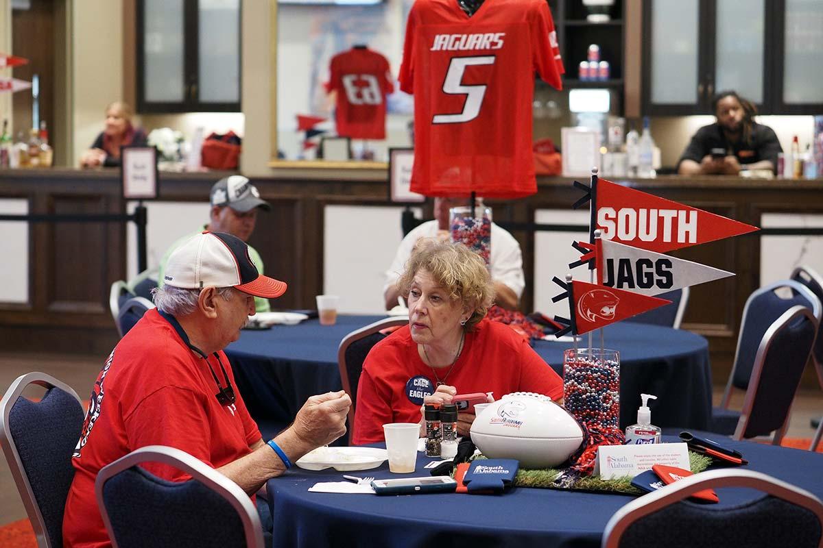 Tailgating group at table with South flags centerpiece