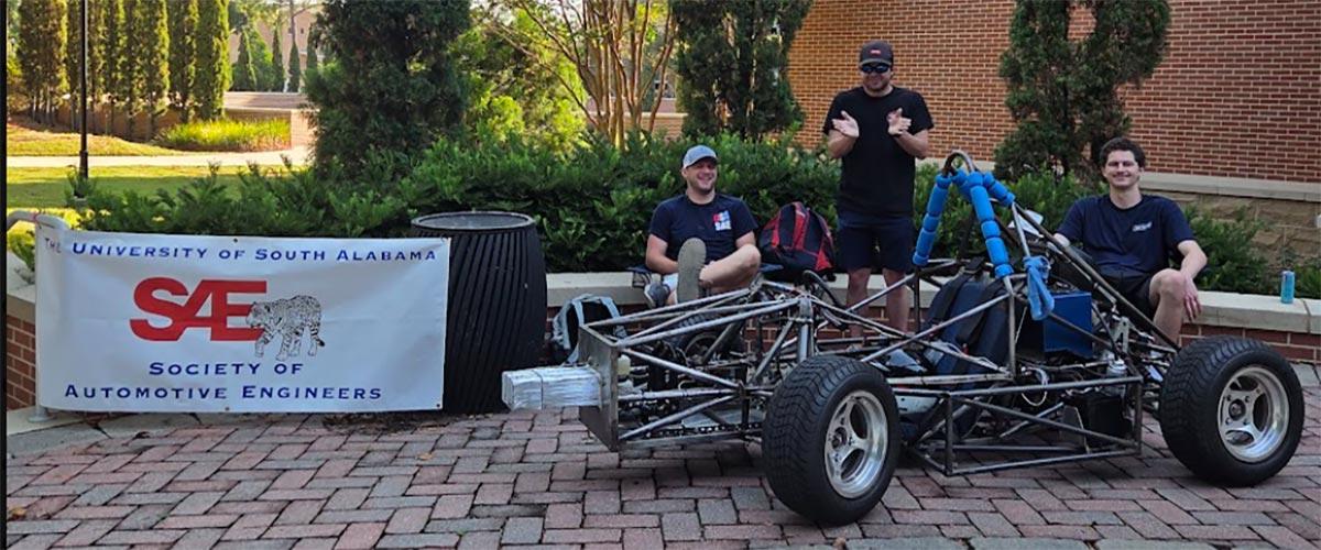 Jag Racing students with car they built.