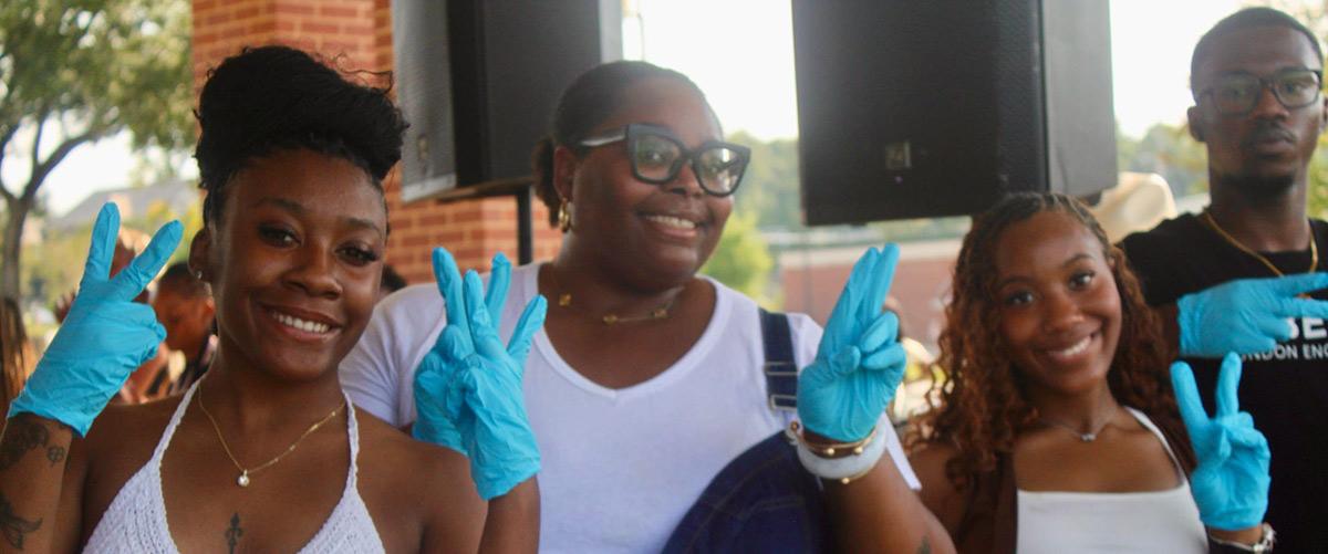 BSU members wearing gloves.