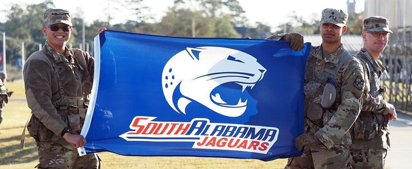 Cadets with South Alabama Jaguars flag