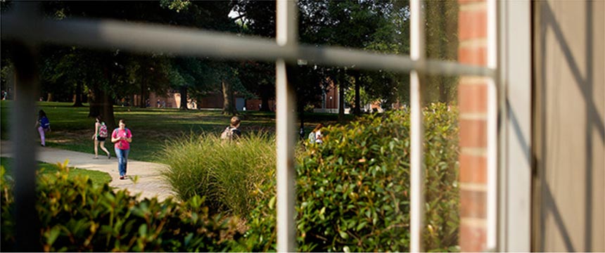 Looking through window onto campus.