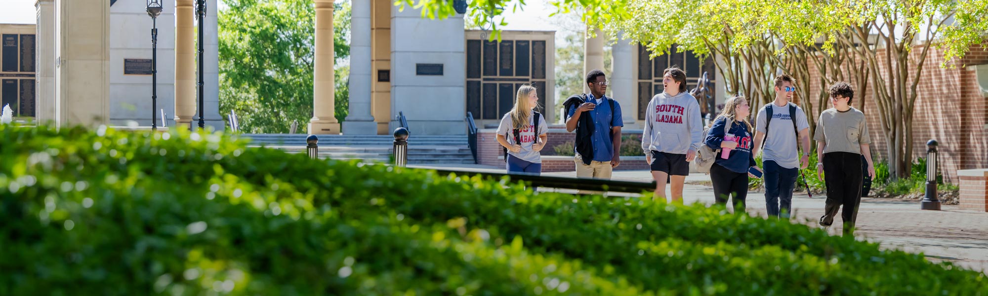 Group of students walking in front of Moulton Tower