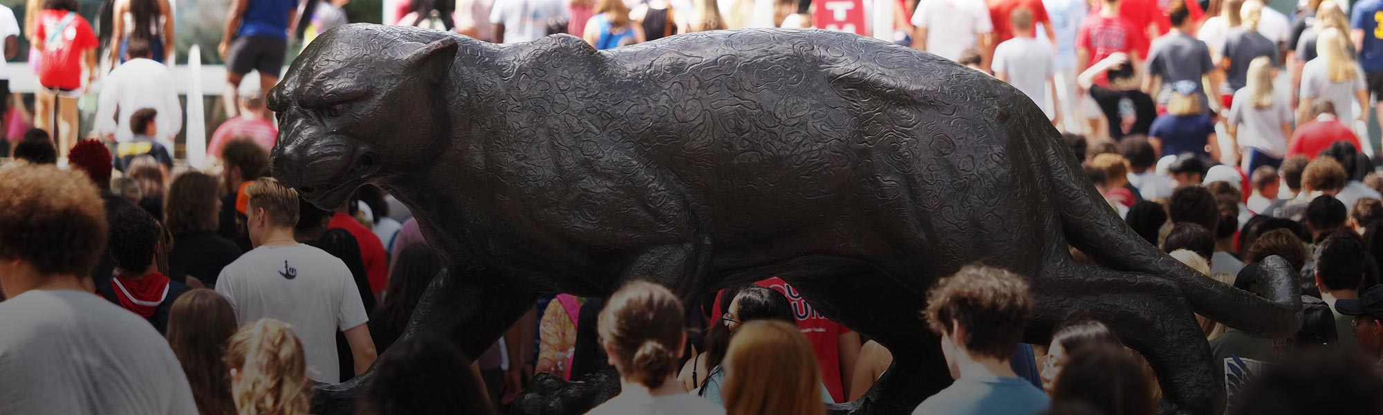 Jaguar statue with convocation students