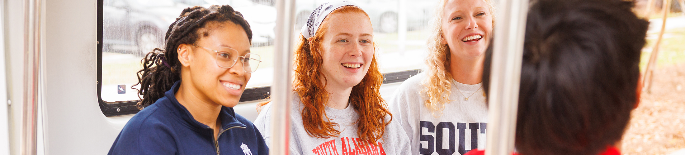 Students on JagTran during campus visit.