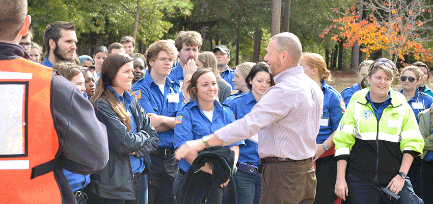 Image of EMS instructor talking to students.