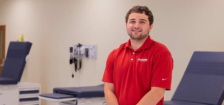 Adam Stephens in a medical exam room.