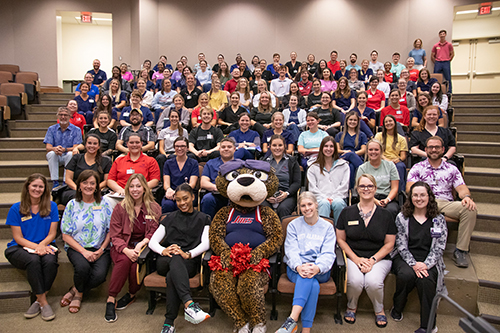 Ms Pawla with USA students in a classroom at the Alabama Head Injury Foundation Camp.