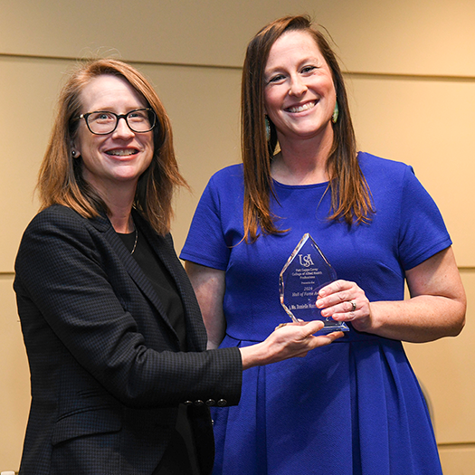 Peters recieving award from Dr. Susan Gordon-Hickey