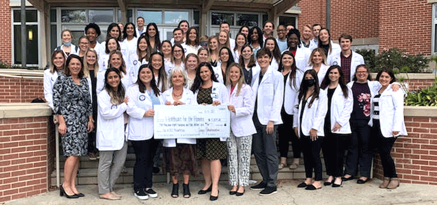 Image of Physician Assistant Studies class outside Health Sciences building.