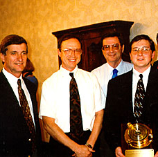 Doug Butts receives the Coastal Weather Research Center's 1997 Service Award from (left to right) Dr. Bill Williams, Dr. Keith Blackwell and Mr. Merritt.