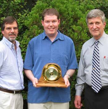 Pete McCarty (left) and Dr. Bill Williams (right) present the Coastal Weather Research Center’s 2008 Service Award to Jason Holmes (center).