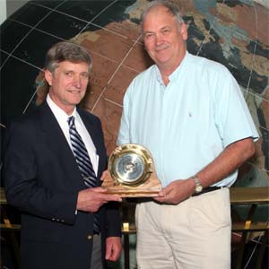 Dr. Jeral Williams (r), Professor of Psychology and former V.P. for Academic Affairs, receives the Coastal Weather Research Center's 2005 Service Award from Dr. Bill Williams (l).