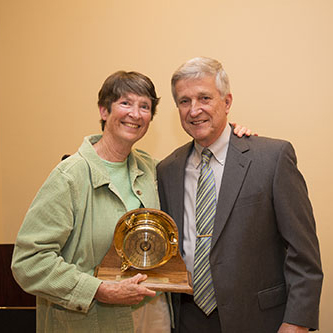 Dr. Miriam Fearn accepts the Coastal Weather Research Center Service Award from Dr. Bill Williams.