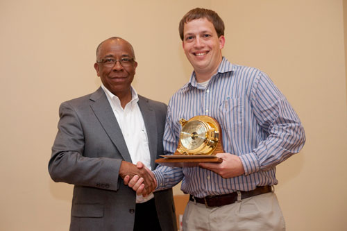 Bradley Simpson (right) receives the 2013 ExxonMobil Academic Award from Richard Benjamin of ExxonMobil
