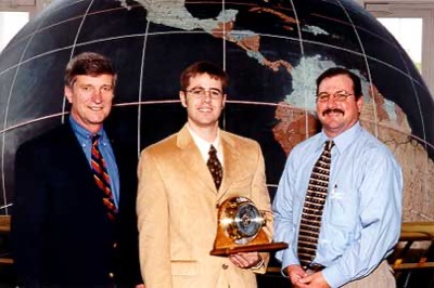 Patrick Gatlin (c) receives the 2002 Exxon Mobil Academic Award from Keith Hebert (r) of Exxon Mobil and Dr. Bill Williams (l)