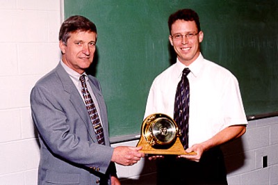 Richard Ernest receives the Coastal Weather Research Center's Academic Award for 2001 from Dr. Bill Williams.