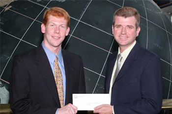 John Walker (l) receives the 2005 ExxonMobil Junior Scholarship Award from Mark Agnew (r), ExxonMobil Operations Superintendent.