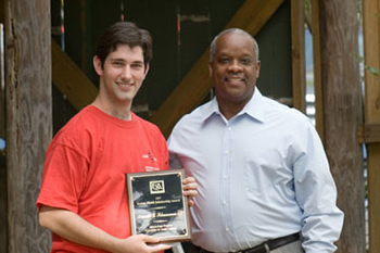 Ronald Schumann accepts the 2007 ExxonMobil Scholarship Award from Tyrone Rogers of ExxonMobil.