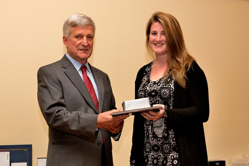 Dr. Bill Williams presents an Outstanding Senior Award to Danielle Bobbin.
