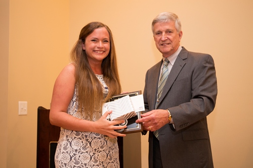 Dr. Bill Williams presents an Outstanding Senior Award to Kelly Neugent.
