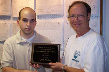 Mike Leach (r), plant manager at the Exxon Mobil refinery in the south Mobile County, presents the 2004 Exxon Mobil Academic Award to Chris Franklin (l).