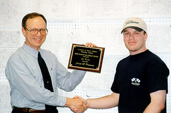 Jared Freeman receives the 2000 Synoptic Meteorology: Top Forecaster Award from Dr. Keith Blackwell.