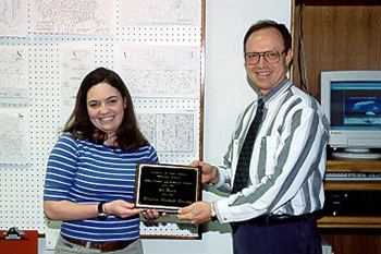 Kristin Hurley receives the 2001 Synoptic Meteorology: Top Forecaster Award from Dr. Keith Blackwell.