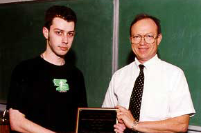Matt Severson receives the 2002 Synoptic Meteorology Top Forecaster Award from Dr. Keith Blackwell.
