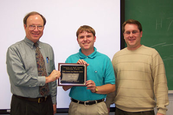 Dr. Bill Williams (r), presents the 2006 Exxon Mobil Academic Award to John Walker (l).