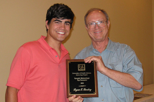 Ryan Beesley receives the 2011 Top Forecaster Award from Dr. Keith Blackwell
