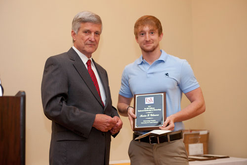 Kevin Gilmore receives a 2013 Endowed Scholarship from Dr. Bill Williams