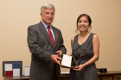 Dr. Bill Williams presents an Endowment Scholarship to Meredith Wyatt.