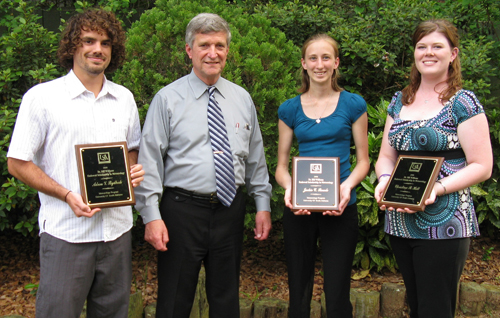 Dr. Bill Williams (2nd from left) presents Meteorology Endowment Scholarships to (l-r) Adam Rydbeck, Jackie Rauch & Christina Holt.
