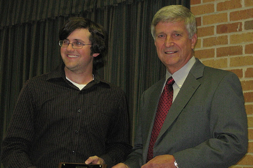 Sidney King receives award from Dr. Bill Williams.