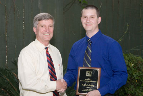 Dr. Bill Williams (L) presents the 2007 Endowment Scholarship to Todd Murphy (R).