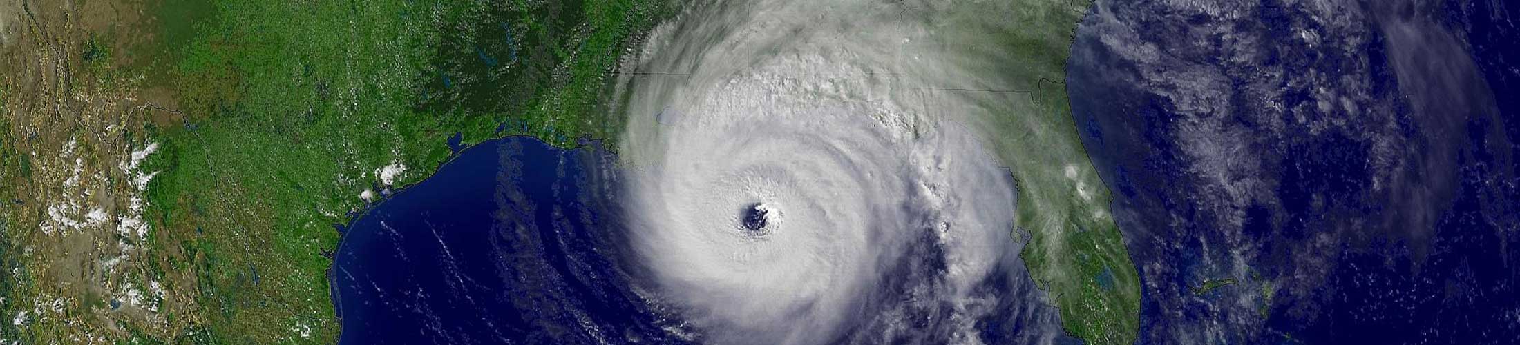 Image of hurricane over land and water.