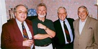 Dan Carter (third from left) joins (from the left) USA History Department chair Dr. Clarence Mohr, USA history professor Dr. Mel McKiven, and USA retired history professor Dr. Howard Mahan