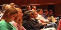 Lecture crowd filling the Laidlaw Performing Arts Auditorium