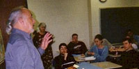 C. Peter Ripley in front of class C. Peter Ripley in front of class