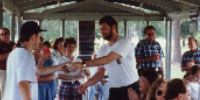 Professor Richmond Brown is awarded a team-autographed ball by Beau Doolittle