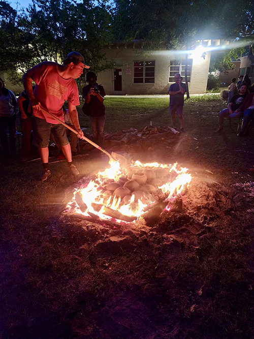 Faculty and students joined together for an open pit pottery firing at the USA Archaeology Museum's Native Plants Garden with the Choctaw Nation of Oklahoma.