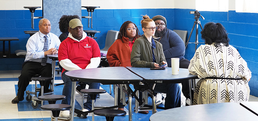 USA Director of African American Studies Dr. Kern Jackson, left, supports his students as they learn through listening in Africatown at the Fifth Annual Spirit of Our Ancestors Festival in February 2023.