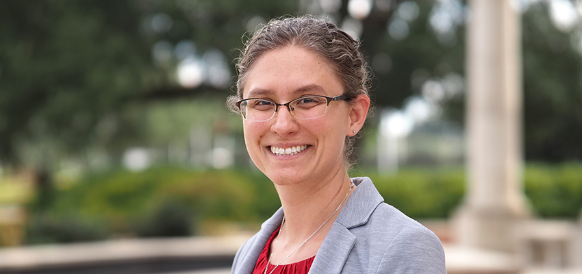 Dr. Joanna Furno standing outside smiling on campus.